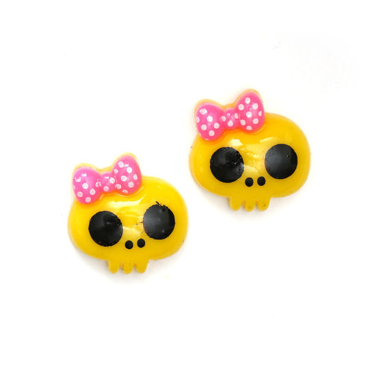 Yellow baby doll skull with bow clip-on earrings